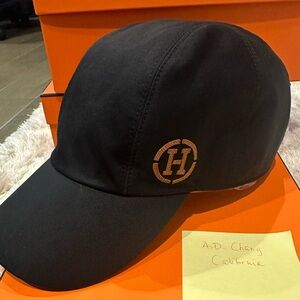 Hermes Black Cap. Size 57 (adjustable). Preloved and in excellent condition.